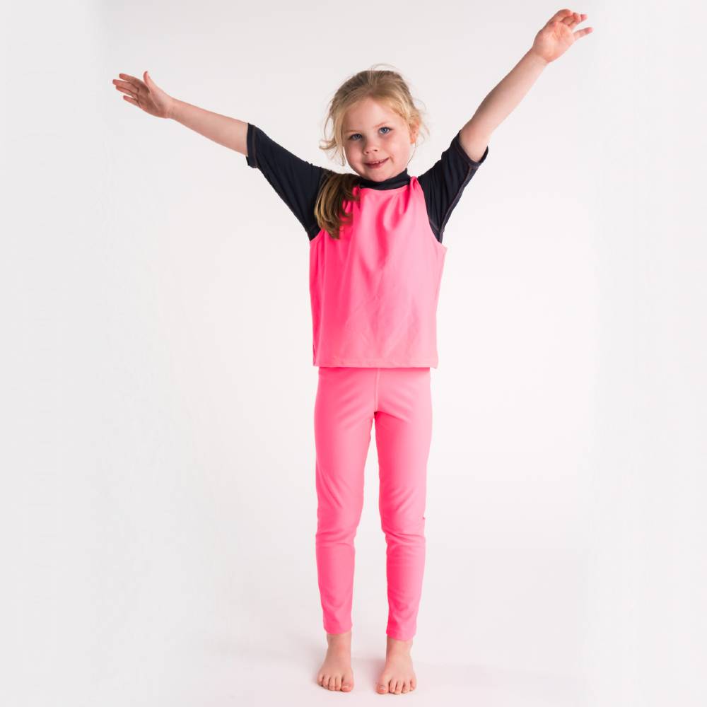 Girl in Neon Pink Over Vest, front shot, hands up
