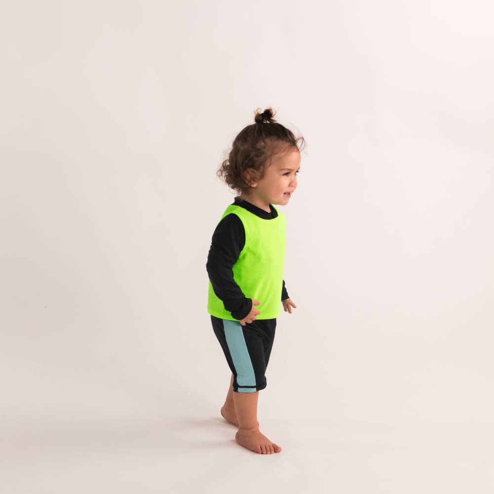 Toddler in Neon Green Over Vest, side shot