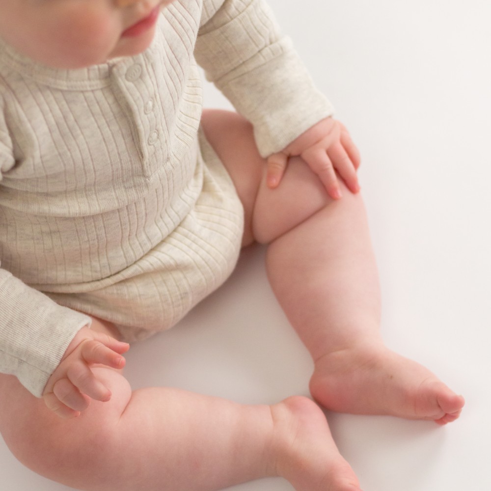 Woolbabe Organic Cotton/Merino Long Sleeve Henley Bodysuit - Natural Marl
