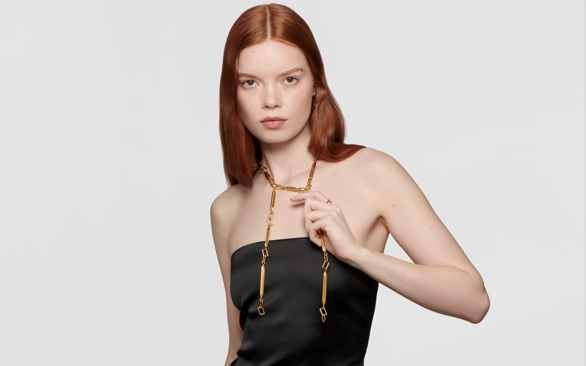 Woman model wearing 22 karat gold necklace