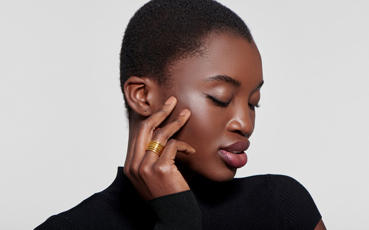 Woman model wearing 22 karat gold ring 