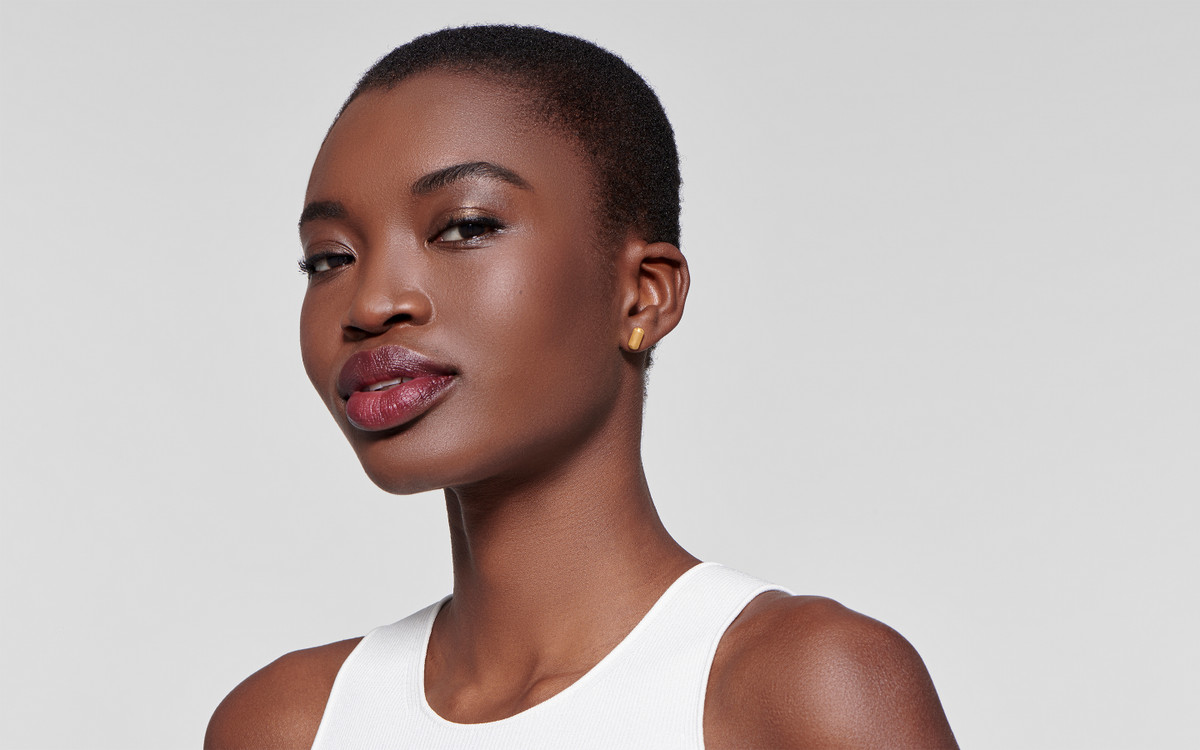 Woman model wearing 22 karat gold earring