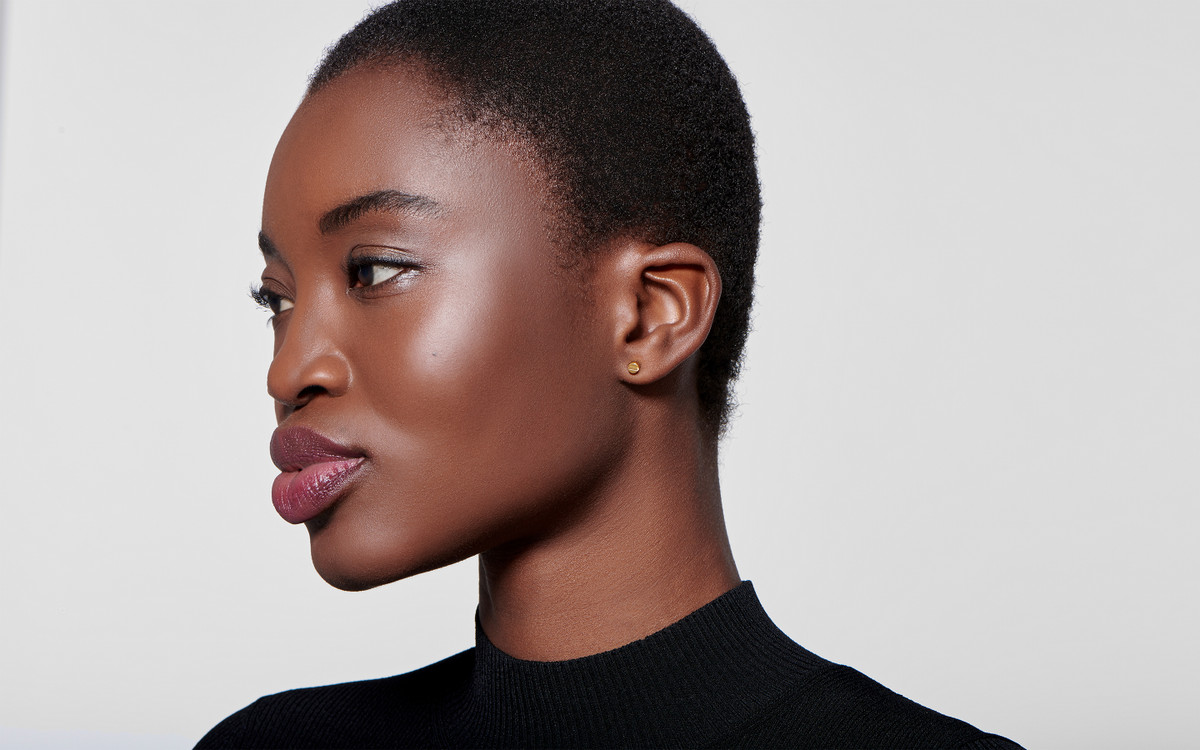 Woman model wearing 22 karat gold earring