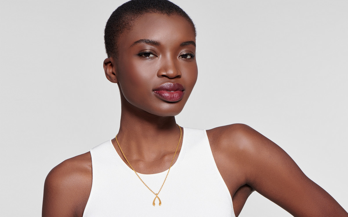 Woman model wearing 22 karat gold necklace 