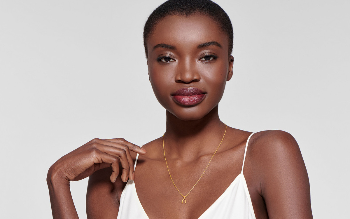 Woman model wearing 22 karat gold necklace 