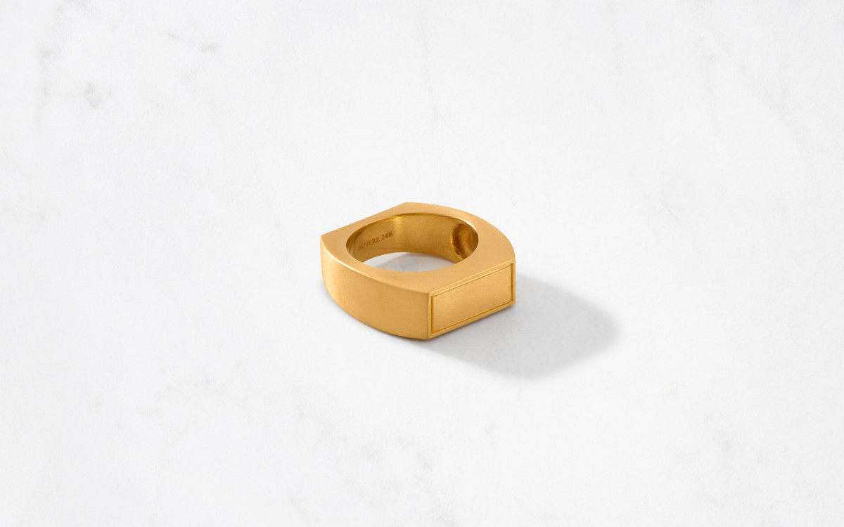 bold 24 karat gold ring with a sleek satin finish