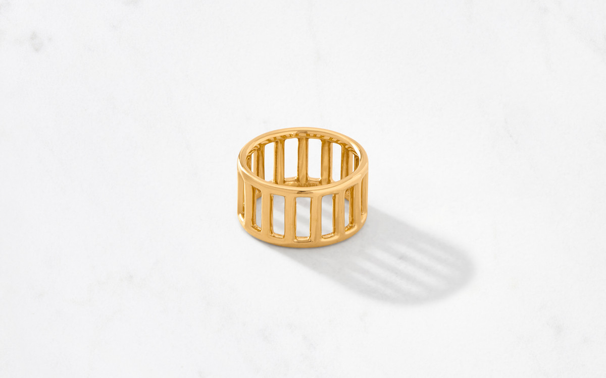 brilliant gold ring crafted from 22 karat polished gold molded to resemble ancient Hellenic  columns