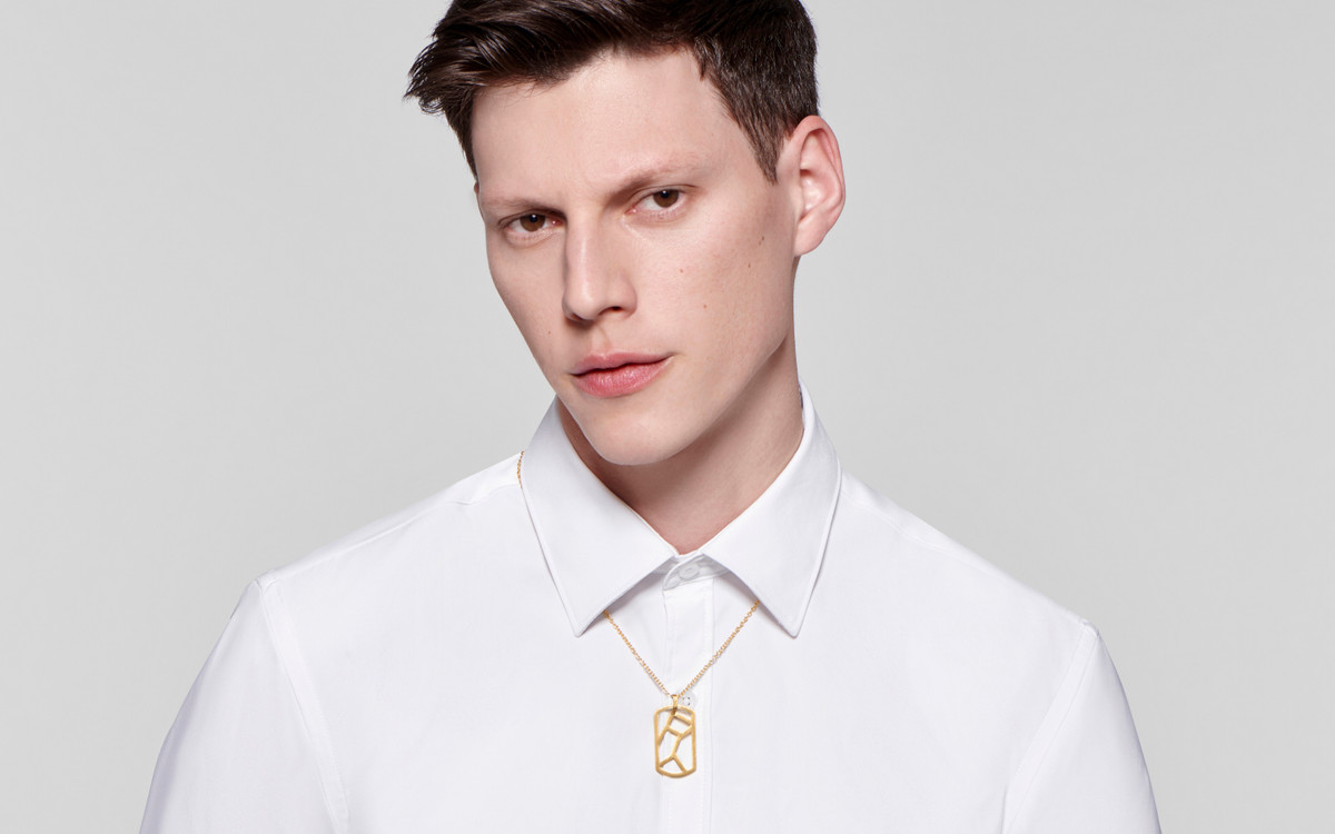 Male model wearing 22 karat gold necklace