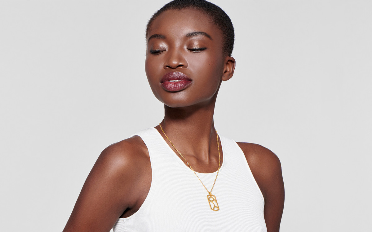 Woman model wearing 22 karat gold necklace