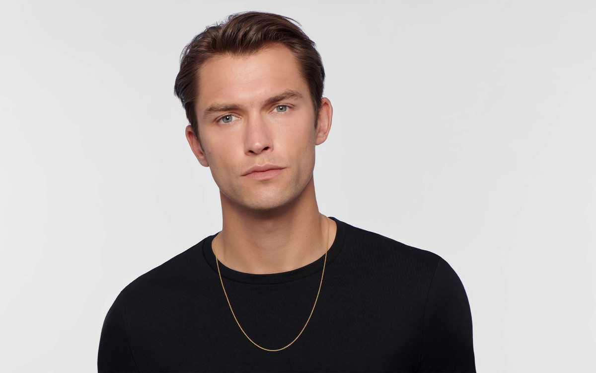 Male model wearing 22 karat gold necklace 