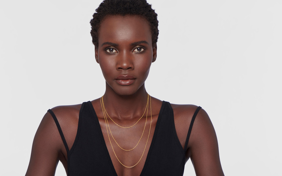 Male model wearing 22 karat gold necklace 