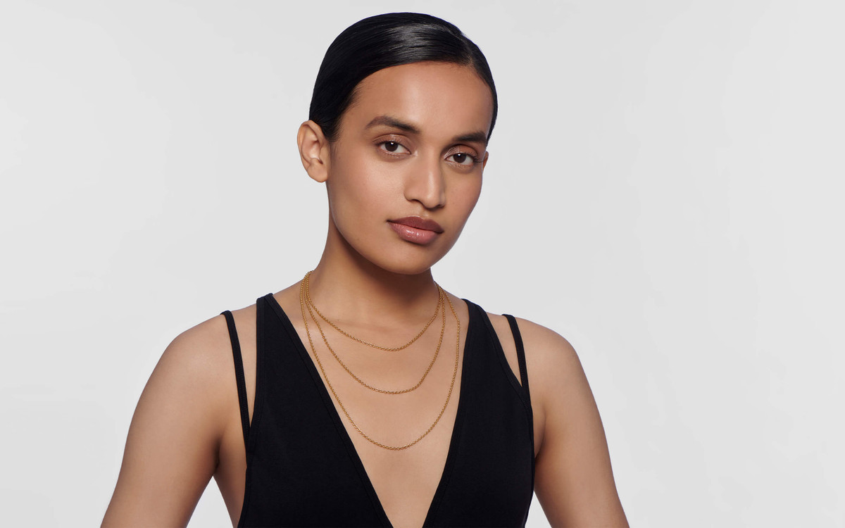 Woman model wearing 22 karat gold necklace