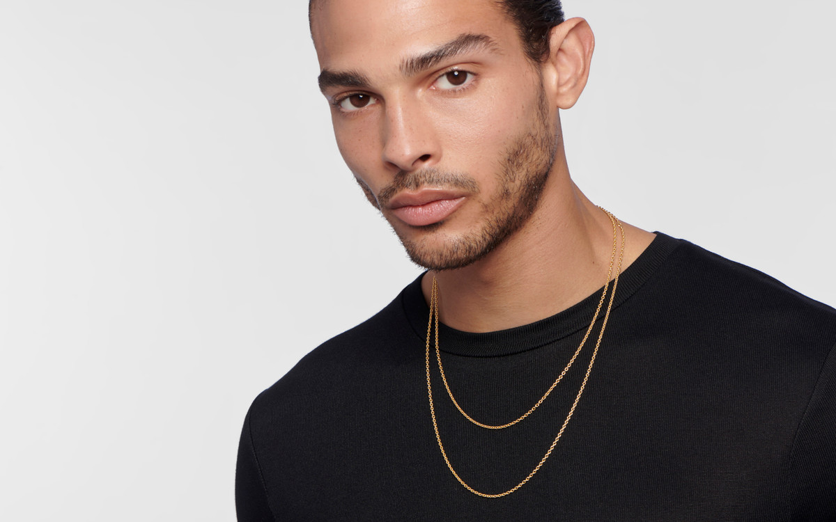 Male model wearing 22 karat gold necklace 