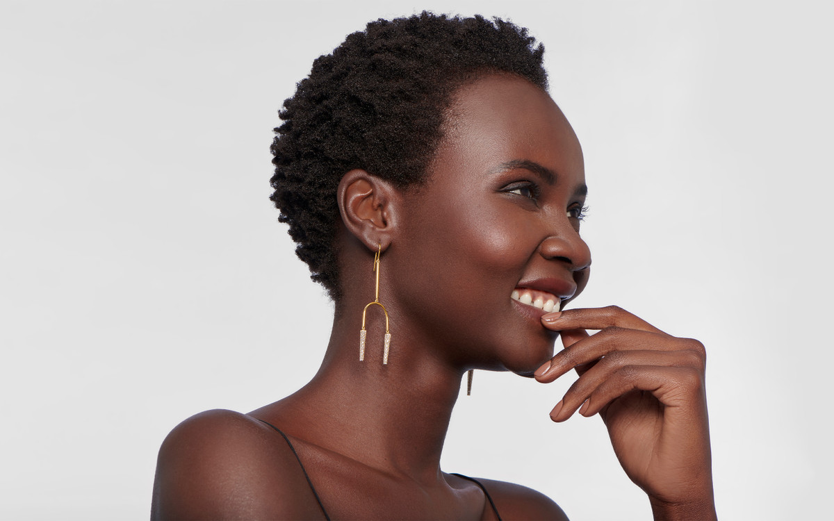 Woman model wearing 22 karat gold earring