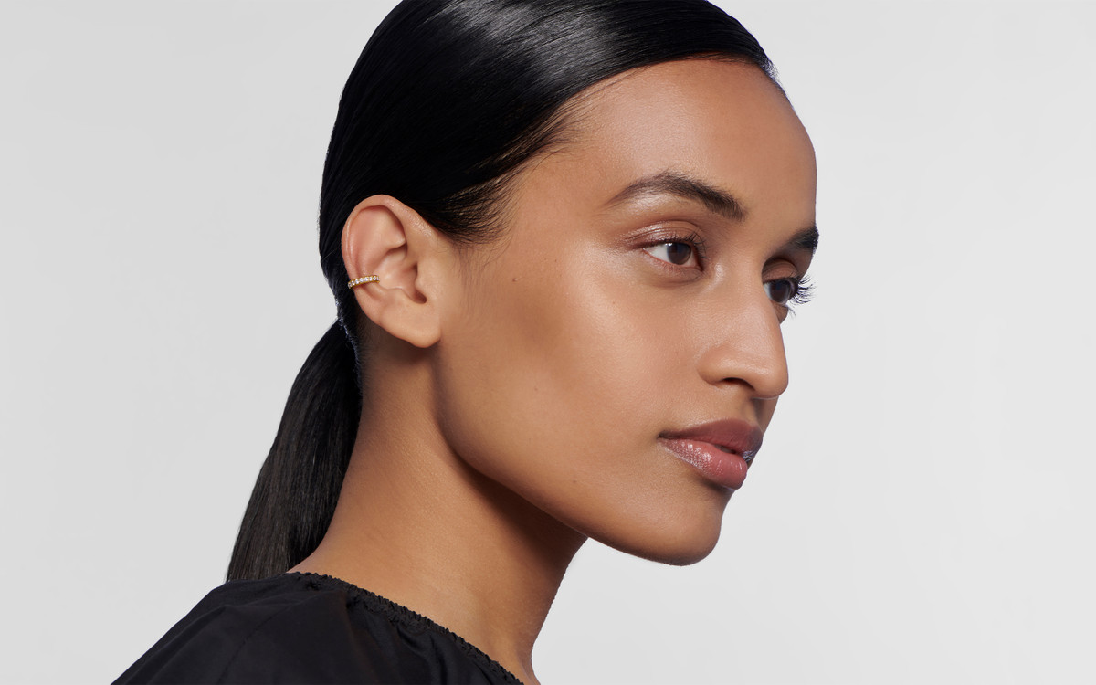 Woman model wearing 22 karat gold earring