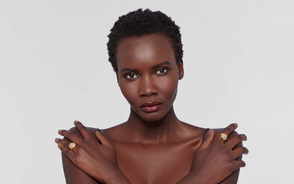 Woman model wearing 22 karat gold earring