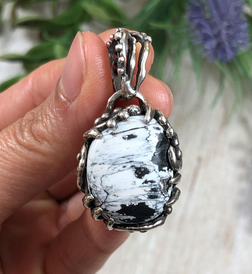 Swirling Sterling Silver and White Buffalo Pendant by Nattarika Hartman.