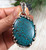 Lost Wax style sterling silver pendant with spiderweb turquoise by Nattarika Hartman