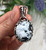 Swirling Sterling Silver and White Buffalo Pendant by Nattarika Hartman.