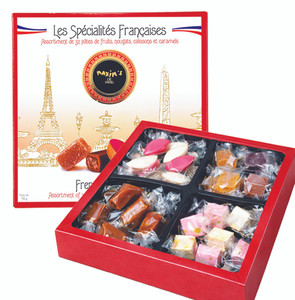 Maxim’s de Paris French sweets gift box with assorted candies and gourmet treats in an elegant red presentation box.