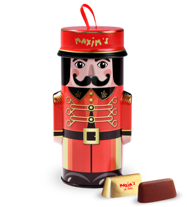 Maxim’s Bellboy Christmas Tin filled with French gianduja chocolates, a festive red and gold collectible tin inspired by Paris and perfect for holiday gifting. Maxim’s Bellboy Christmas Tin filled with French gianduja chocolates, a festive red and gold collectible tin inspired by Paris and perfect for holiday gifting.
