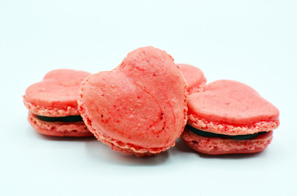Heart shaped macarons, dark chocolate and fresh raspberry Heart shaped macarons, dark chocolate and fresh raspberry