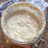 Close-up of bubbly active sourdough starter ready for homemade bread baking.