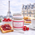 French raspberry jam served on toast with fresh raspberries, Paris breakfast scene with Eiffel Tower background.