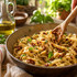 Délices du Luberon Sundried Tomato Spread stirred into pasta with olive oil and Parmesan, serving suggestion