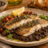 Délices du Luberon Eggplant Caviar served as a side with grilled fish and lemon — Provençal serving suggestion