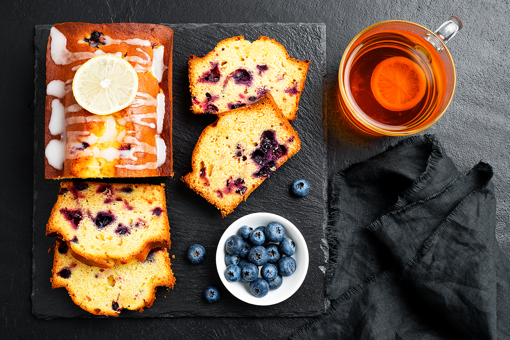Slice of blueberry cake, mulled wine in a glass, served alfresco on skiing  slope in French Alps Stock Photo - Alamy