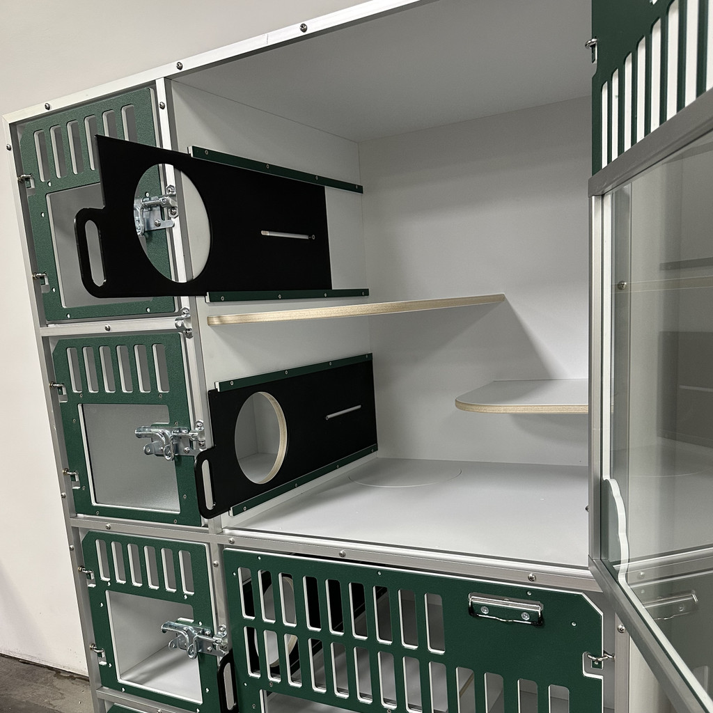 Cat Hotel Unit with forest green, glass doors. Shows the sliders can block off the litter box and feeding areas