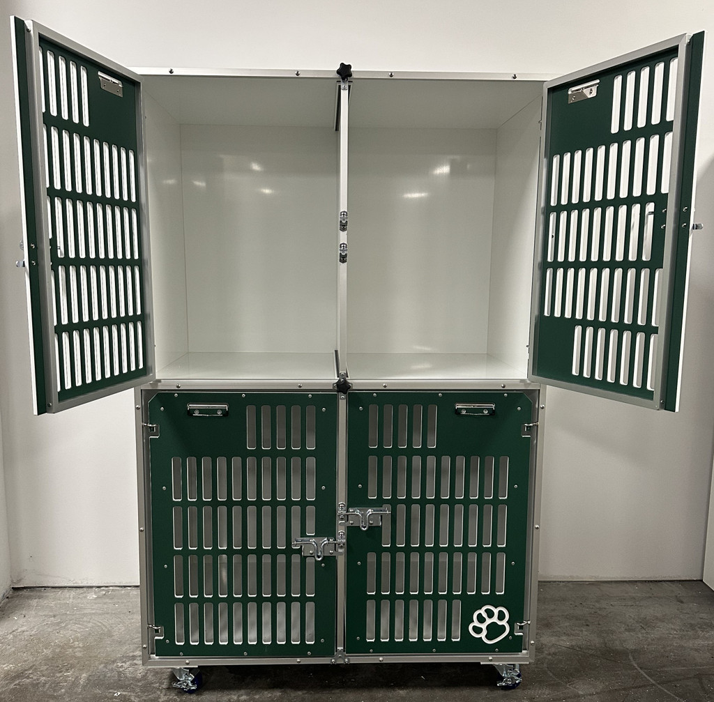 Double stacked kennel with forest green slotted gates.