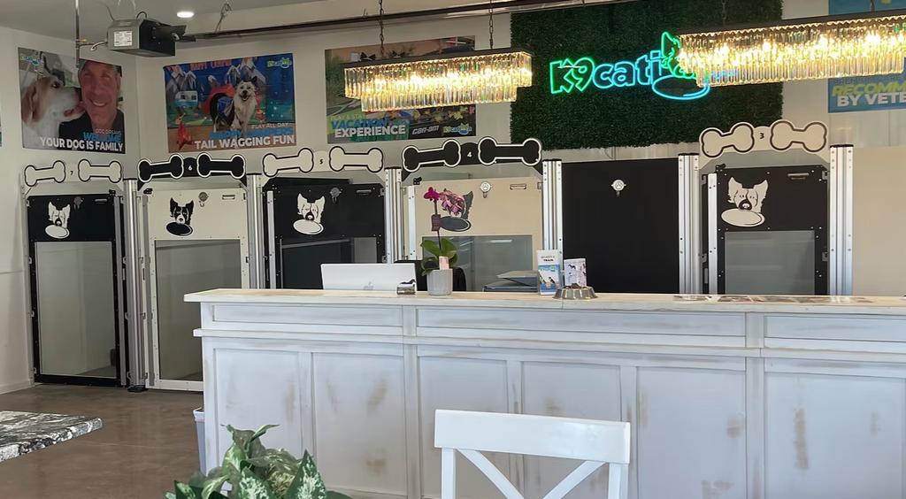 In this picture you get to see the full glass of the kennel doors on the end kennel row. You can also see that the headers are the opposite color of the kennel which adds a fun charm to the alternating color layout. Each kennel door or gate comes with a complimentary clipboard for keeping guests information right at hand and with the pet.