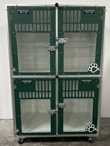 Double stacked kennel with glass doors in forest green.