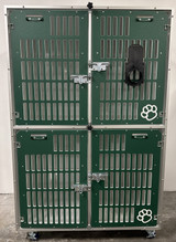 Double stacked kennel with slotted gates in forest green, with a cage dryer attachment hung on the gate.