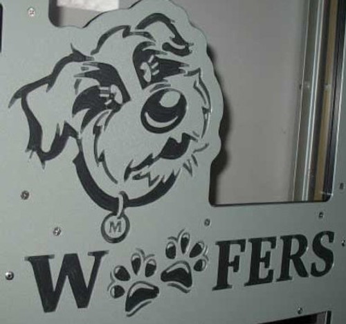 Woofers' custom logo engraved on their kennel gate.