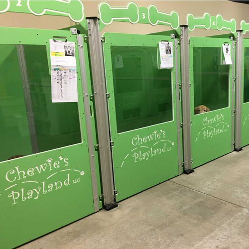 Chewie's Playland's custom green dog kennels.