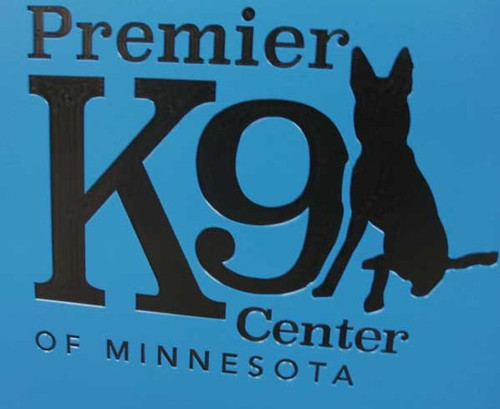 Premier K9 Center of Minnesota's custom logo on their kennel gates.