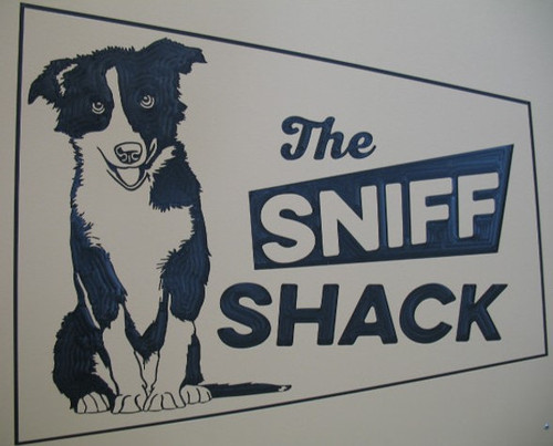 The Sniff Shack's custom logo on their kennel gates.