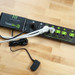 Black Advanced Power Strip Tricklestar on wood floor