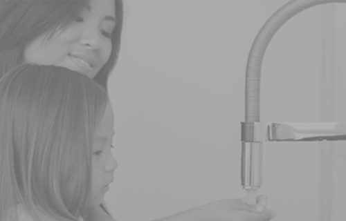 Mother and daughter washing hands