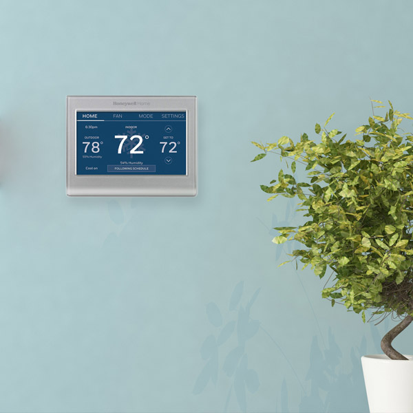 https://cdn11.bigcommerce.com/s-fdvynbokm5/product_images/uploaded_images/honeywell-thermostat-color-blue-in-living-room.jpg