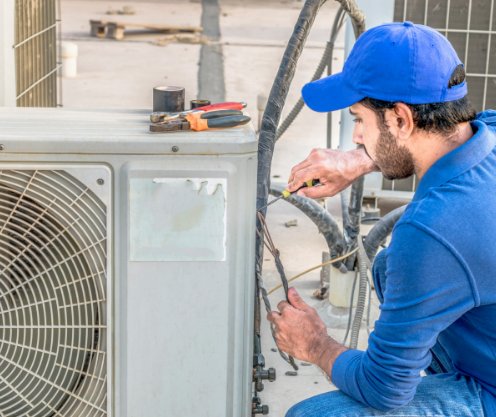 Man installing AC unit