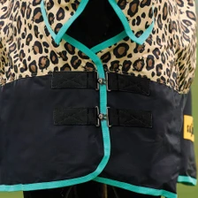 Front of the Saxon Defiant 600D Turnout Combo 200g - Leopard Print