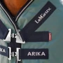 LeMieux Arika 600D Ripstop Turnout Rug 200g in Aloe - Angled Front Closure