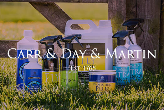 Carr & Day & Martin logo with horse lotions and sprays in background