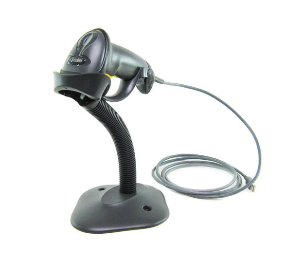 LS2208-SR20007R-NA-PF - Zebra LS2208 Corded barcode scanner designed for general-purpose use. It utilizes 1D laser technology to scan standard-range barcodes. The scanner is handheld features a black casing with IP30 protection and includes a stand for hands-free operation. It connects to a computer via a USB cable.