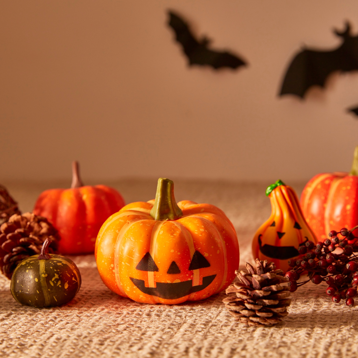 Collage of autumn crafts and seasonal scenes, including a forest path with fall leaves, cozy yarn and knitting supplies, painted pumpkins, colorful fall foliage, and close-up oak leaves with raindrops.