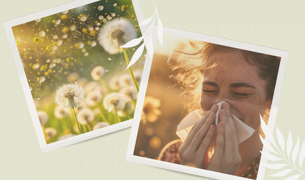 A smiling woman in athletic wear holds a red heart while standing outdoors, representing heart health and cardiovascular wellness.